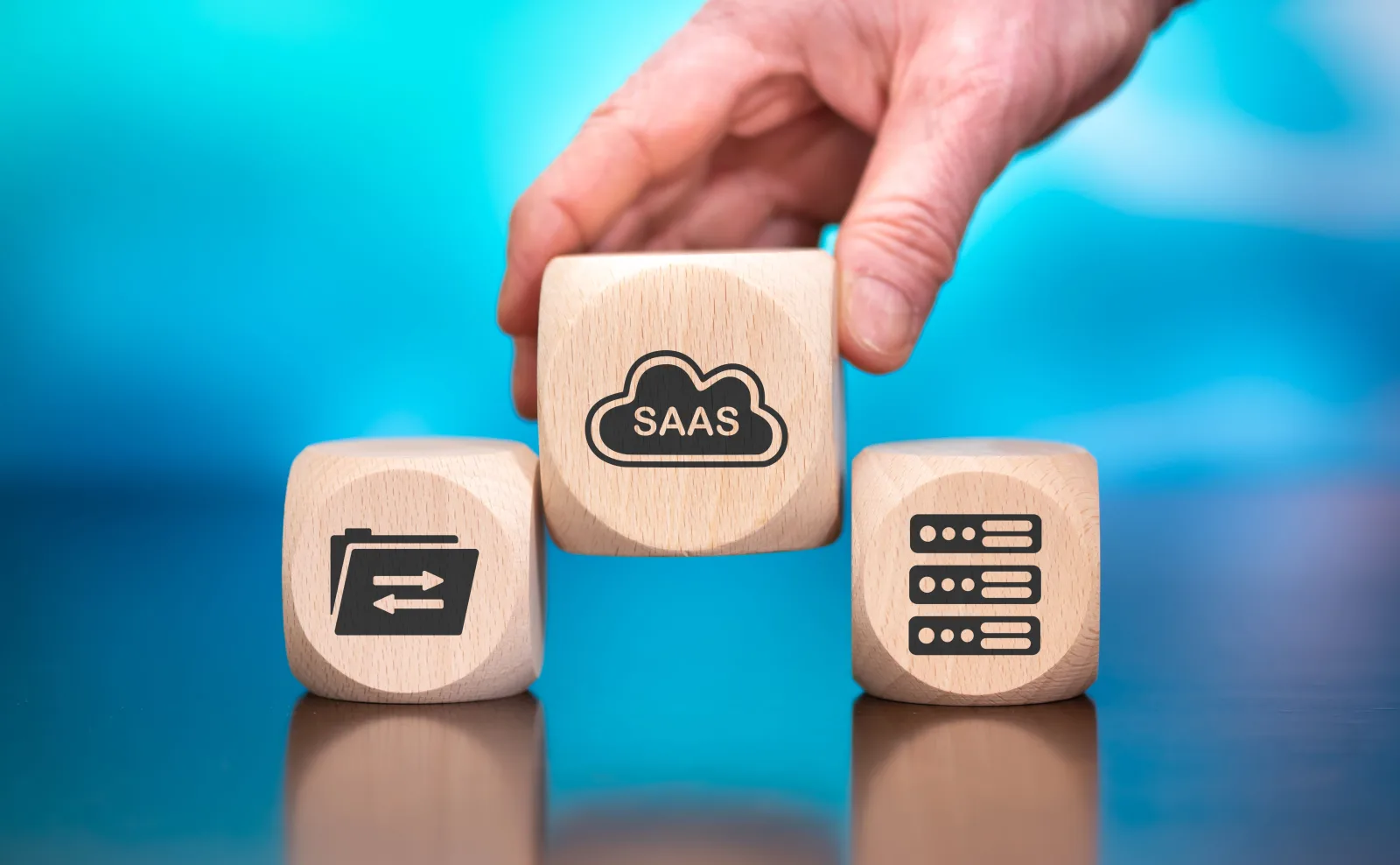 SaaS concept blocks on a blue background representing embedded payment infrastructure for software platforms.