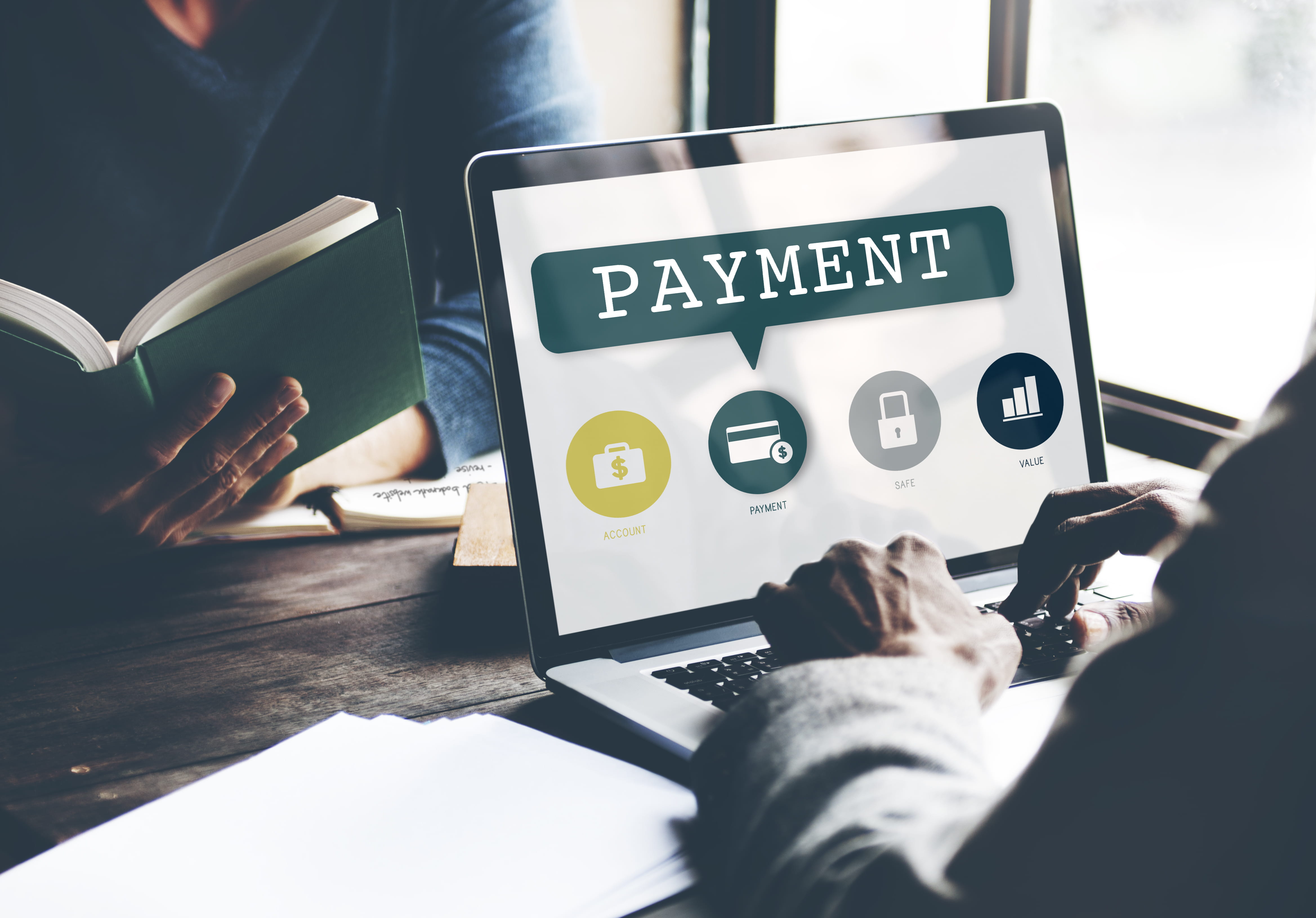 A business owner using software that combines operations and payment processing.